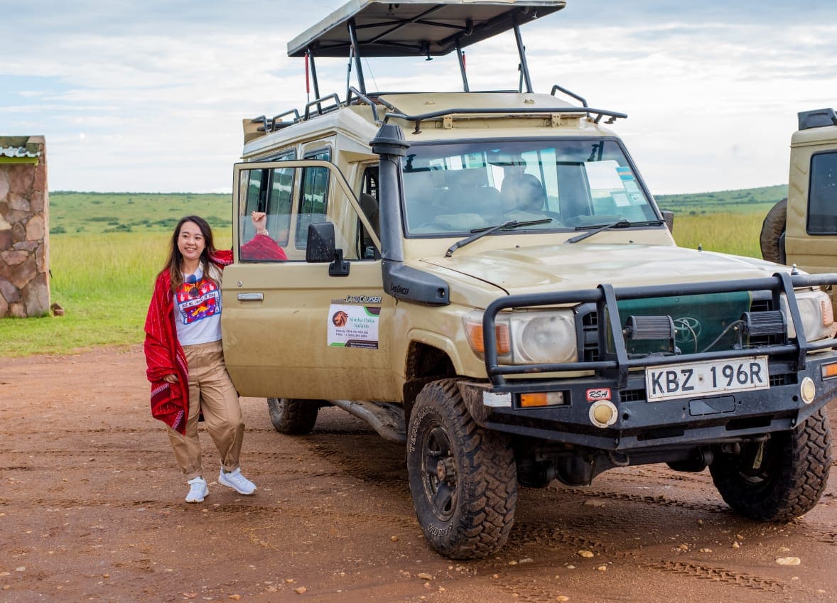 Safari land cruiser during full day game drive in Masai Mara